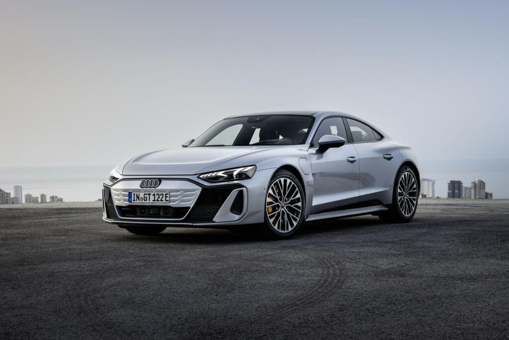 Audi e-tron gt stay on the top with beautiful high buildings background