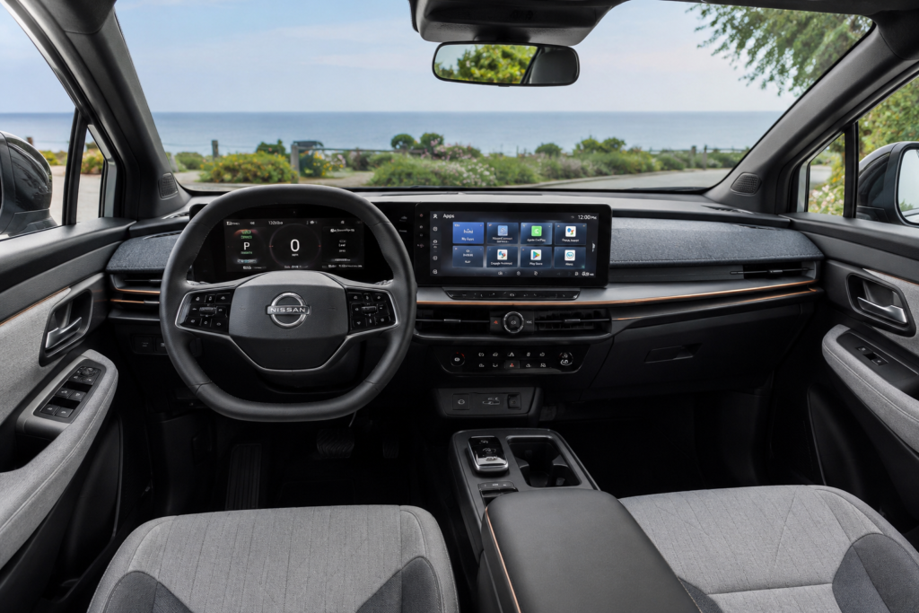 simple and beautiful interior of Nissan leaf with large touch screen and cluster board