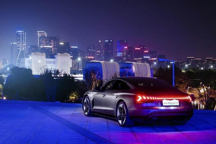 simple Audi RS e-tron GT stay in city with around beautiful blus lights