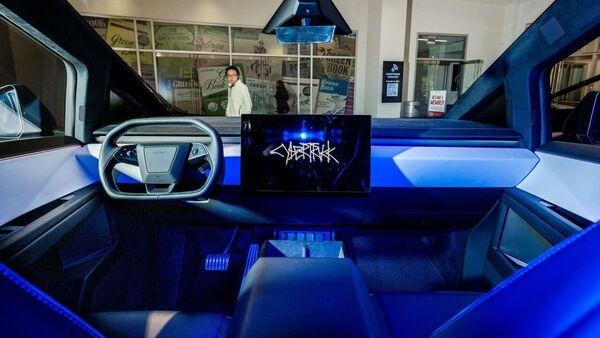 simple interior of cybertruck with blue lights and large touch screen