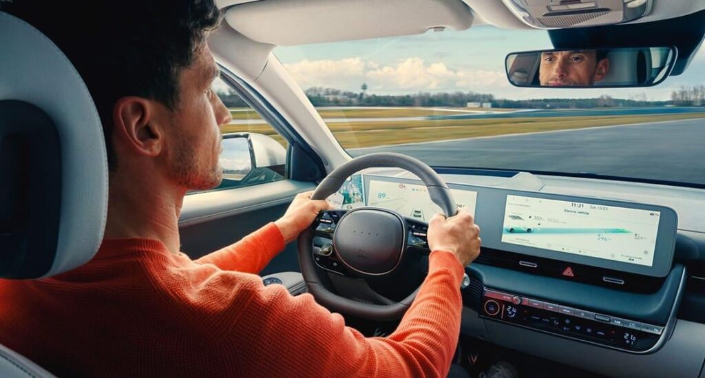 A man drive  Hyundai Ioniq 5 Long Range and show power info on touch screen and cluster board
